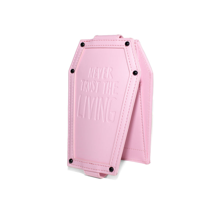 Pink faux leather cardholder in coffin shape.
