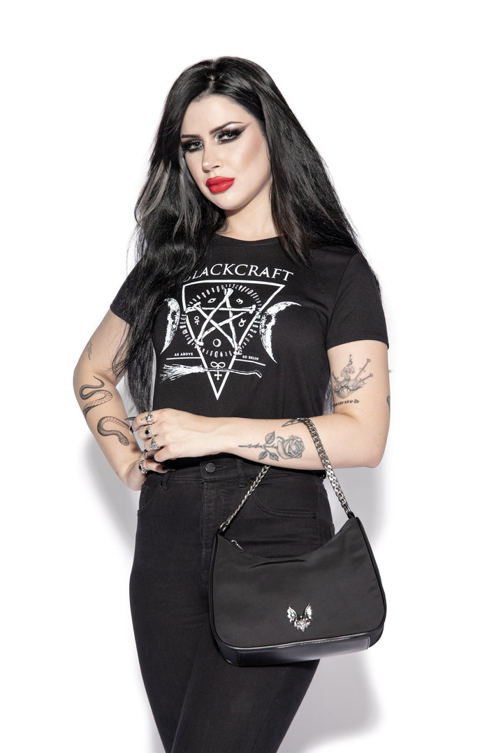 Black nylon crossbody bag with chain top handle and removable coin purse attachment.
