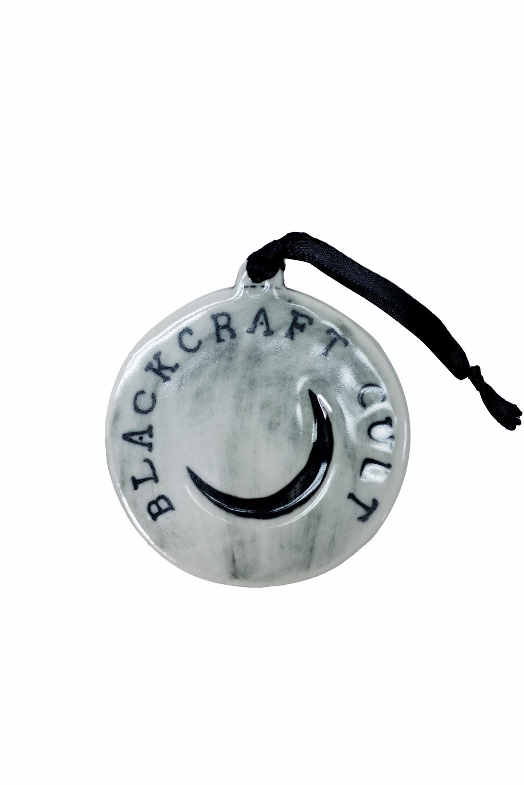 A three piece ceramic Christmas tree ornament set with skull, moon, and rose ornaments. From Blackcraft.