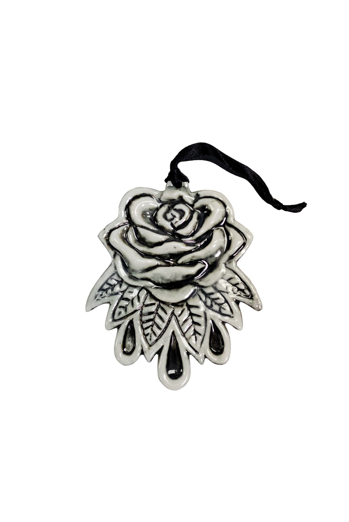 A three piece ceramic Christmas tree ornament set with skull, moon, and rose ornaments. From Blackcraft.