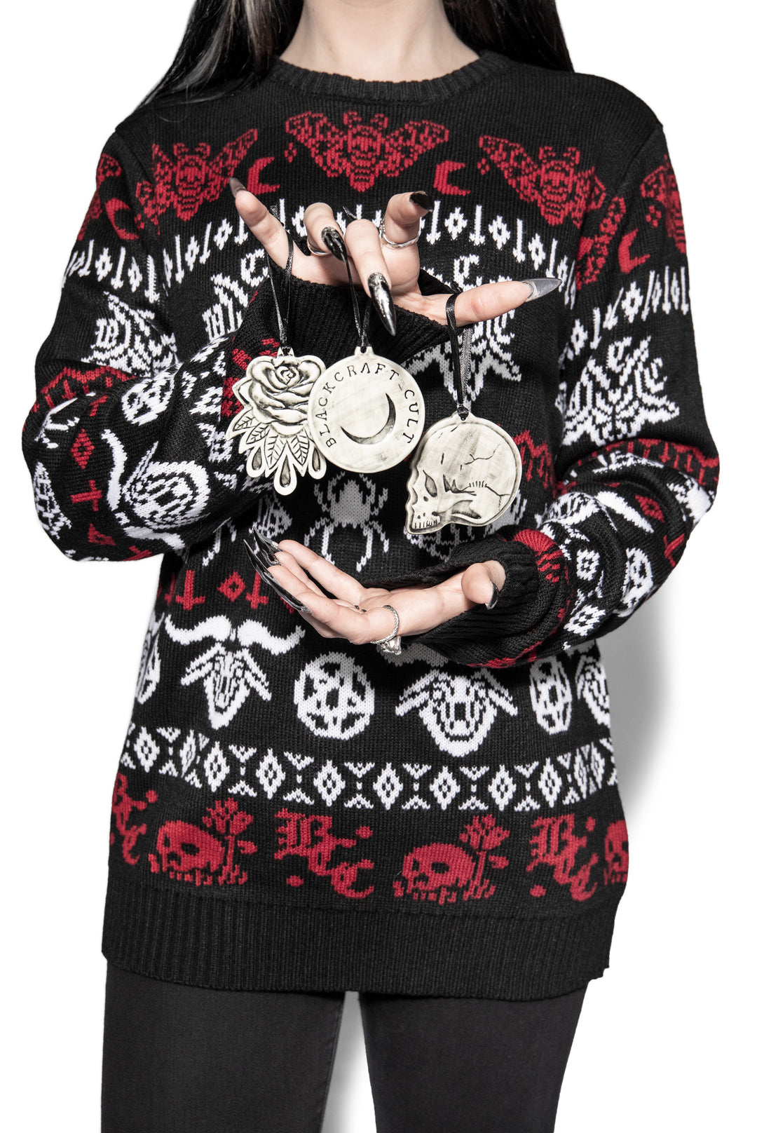 A three piece ceramic Christmas tree ornament set with skull, moon, and rose ornaments. From Blackcraft.